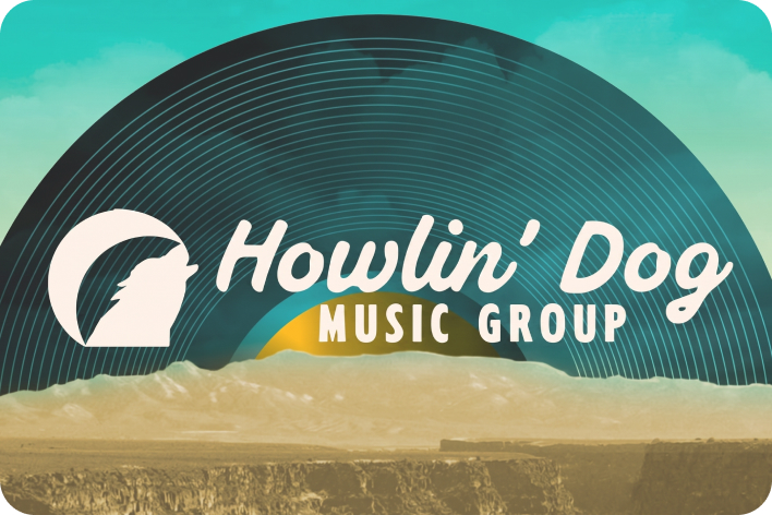 Howlin’ Dog Music Group: vinyl record over a desert horizon at dusk